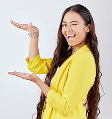 Image showing Studio gesture, business portrait and happy woman wink for service advertising, promo news notification or brand announcement. Commercial, mockup space or person smile for product on white background