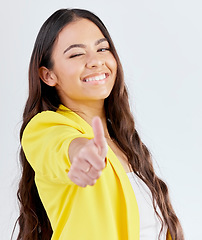 Image showing Portrait, support and woman with thumbs up, promotion and success against a white studio background. Wink, female person or model with hand gesture, achievement or like with symbol or positive review