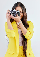 Image showing Smile, portrait and a woman with a camera for a photo, memory or career in photography. Happy, paparazzi and a young girl or photographer taking a picture isolated on a white background in studio