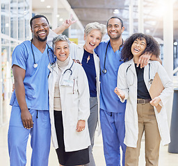 Image showing Happy portrait, team and doctors for healthcare service, leadership and teamwork in hospital diversity. Professional medical woman, mentor and internship nurses in group, funny peace sign or excited