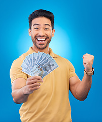 Image showing Money, fist pump portrait and man excited for dollar bills, financial achievement award or bonus salary prize. Show cash, happy winner and person cheers for income, revenue or win on blue background