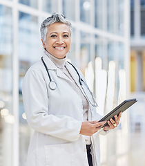 Image showing Portrait of doctor, woman and tablet for medical review, data research and healthcare in hospital. Happy female physician, digital technology and planning telehealth network, connection or online app