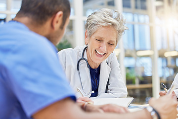 Image showing Meeting, laughing and doctors or people talking and planning for hospital, healthcare or clinic management. Schedule, writing and medical nurse, happy mentor or woman with internship documents