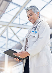 Image showing Doctor, woman and smile with tablet for medical information, data research or healthcare in hospital. Happy female employee, digital technology and planning telehealth, internet app or online results