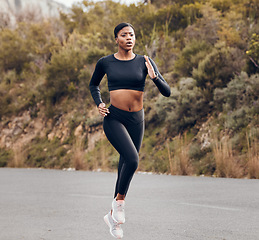 Image showing Mountain, running and woman for fitness, exercise and speed training, outdoor challenge and focus on road. Fast professional runner, athlete or african sports person for cardio workout or marathon