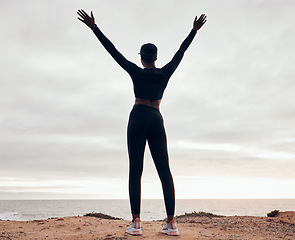 Image showing Success, fitness and back of woman in nature with achievement, celebration and goals for workout. Sports, freedom and happy female person with hands in air for exercise, training and running target