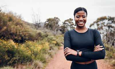 Image showing Fitness, smile and portrait with black woman in nature for health, workout and running. Performance, sports and exercise with female runner training on mountain trail for speed, marathon and wellness