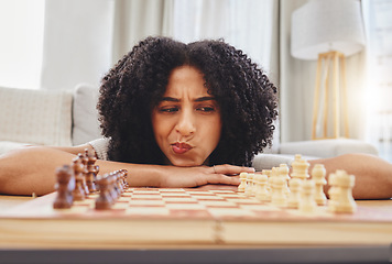 Image showing Chess, thinking and portrait of woman with board for strategy, problem solving and challenge at home. Competition, ideas and female person with chessboard in living room ready for playing games