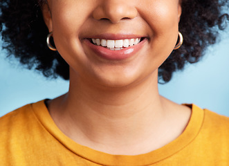 Image showing Smile, woman and closeup of mouth and teeth for dental care, hygiene and whitening results. Happy, model and girl showing tooth for treatment progress isolated on a blue background in a studio