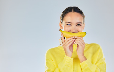 Image showing Happy, banana and portrait of woman with fruit in studio for healthy eating, wellness and diet. Food, lose weight and mockup person on white background with fruits for nutrition, detox and digestion