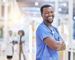 Image showing Nurse, portrait and black man with arms crossed, funny and excited in hospital. African surgeon, face and confident medical professional, happy employee or healthcare worker laughing for wellness.