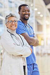 Image showing Doctor, together and portrait with cross arm and smile at hospital with medicine. Healthcare professional, team and senior female and man at clinic for support with collaboration for help or service.