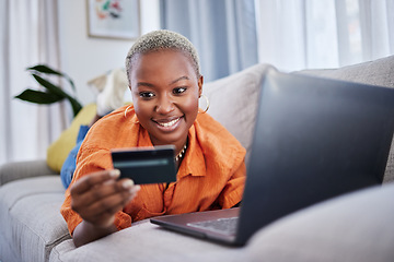 Image showing Laptop, relax or happy woman online shopping with credit card for digital product with discount code. Smile, promo or black girl with financial payment to buy on sale on fintech application at home