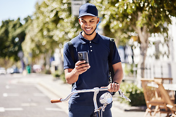Image showing Bicycle, phone and delivery man use phone gps to navigate the street of a city for a package, product or fast food. Bike, mobile app and courier employee use a map online, internet or ecommerce web
