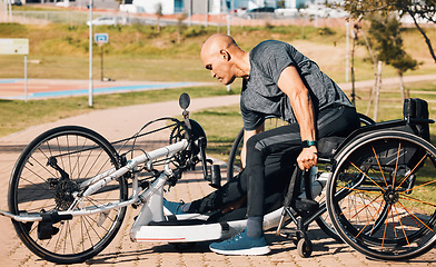 Image showing Wheelchair, athlete or a man with a disability and bike for handicap race, fitness and recumbent challenge. Exercise, park and a handbike of paraplegic sports person outdoor for cardio and training