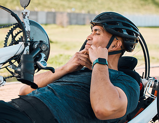 Image showing Helmet, athlete and a man with a disability and bike for handicap race, fitness and recumbent training. Exercise, protection and a handbike for paraplegic sports person outdoor for cycling or cardio