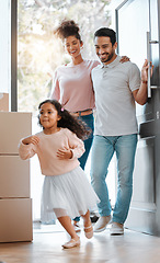 Image showing Happy family, real estate and moving in new home for investment, property or fun relocation by door. Father, mother and daughter smile playing in house for mortgage loan, renovation or beginning