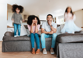 Image showing Children jumping with stressed parents on the sofa to relax in the living room of their house. Upset, burnout and excited kids playing with blur motion on couch with tired exhausted mother and father