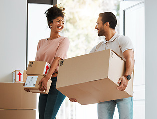 Image showing Couple, box and excited in new home, happy or together for moving, beginning and commitment for mortgage. Man, woman with cardboard package, smile or start life in property, real estate and apartment