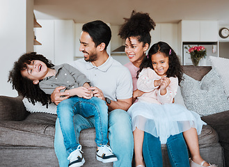 Image showing Mom, dad and children on sofa, playing and happy family bonding together in living room in Mexico. Smile, happiness and parents relax with kids on couch, quality time and fun in new home or apartment