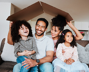 Image showing Sofa, parents and kids with cardboard roof and happy family together in living room of new home. Property, happiness and mom, dad and children on couch, mortgage and insurance with future security.