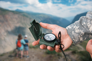 Image showing Man with compass in Altai mountains