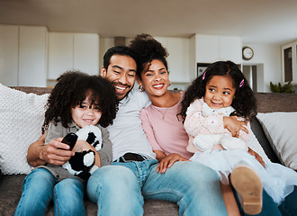 Image showing Portrait of mom, dad and kids on sofa, watching tv and happy family bonding together in living room. Smile, happiness and parents relax with children on couch, streaming television show or movies.