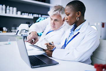 Image showing Teamwork research, laptop and doctors in a laboratory for internet, data or results. Serious man help a woman scientist with tech for scientific innovation, planning or teamwork with a mentor