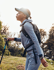 Image showing Hiking, fitness and black woman in nature walking for exercise, cardio workout and adventure in woods. Sports, endurance and female person trekking in forest for healthy body, wellness and freedom