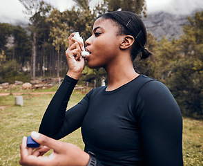 Image showing Black woman, breathe or asthma pump outdoor in park for help with health risk, cough treatment and air for exercise. Female runner, spray and medicine inhaler in nature for lungs, oxygen and wellness