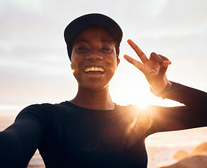 Image showing Selfie, fitness and portrait of woman at sunrise in nature for exercise, marathon training and running. Sports, mockup and African female person with peace sign for warm up, workout and wellness