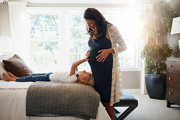 Image showing Home bedroom, pregnant woman and child touch, feel or massage stomach or excited for baby movement. Expectation, maternity and relax kid check life growth, pregnancy or belly of mother or mom on bed