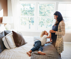 Image showing Happy family bedroom, woman pregnancy or child touch stomach to check fetus, moving tummy or prenatal abdomen. Youth kid, pregnant mother and curious for baby fertility development on apartment bed