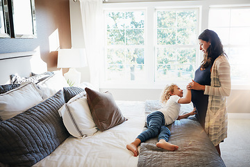 Image showing Bedroom, woman pregnancy or child touch stomach to check prenatal fetus, moving or tummy. Youth kid, pregnant mother and curious for life, maternity or baby fertility development on apartment bed