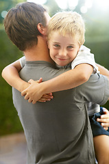 Image showing Portrait of father hugging child in backyard, cute bonding together in care and love in garden. Outdoor fun, support and dad holding playful son with smile, trust and happy man with kid at playground