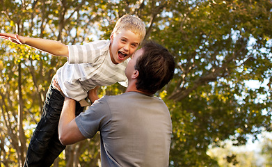 Image showing Father, child and backyard with airplane game, happy bonding and fun morning playing for dad and son. Outdoor fun, love and playful energy, man holding boy in air and laughing in garden together.