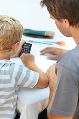 Image showing Learning, math and father help child with homework or homeschool as education and development in a home. Calculator, parent and dad support or teaching kid to count, numbers and studying for exam
