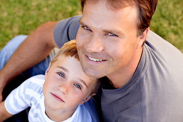 Image showing Smile, portrait and dad with son on grass, cute bonding together with care and love in backyard from above. Fun, father and child in garden with happy relationship, trust and support with man and boy