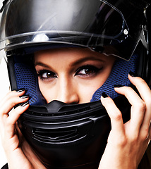 Image showing Wear motorbike helmet, portrait and woman in studio isolated on white background. Biker, serious girl and face for safety, protection and fashion style, racer and driver with hand manicure or makeup