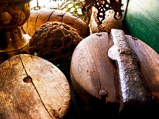 Image showing Closeup of fishing barrels, lines and rope, net and storage of traditional equipment at port. Tools, fishery and mesh, vintage wood and old metal, retro cordage and antique fishnet in industry