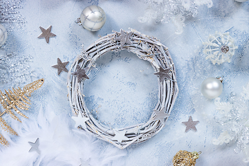 Image showing Making Christmas wreath with assorted ornaments, balls in white and silver color