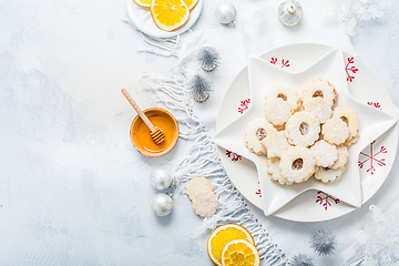 Image showing Homemade Christmas cookies with orange and honey.  Christmas decoration with ornaments.