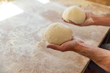 Image showing Bread dough balls in bakery