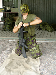 Image showing Army, training to assemble a gun with a man soldier outdoor in camouflage uniform for an exercise. Military, blindfold and a trooper person at bootcamp to build a weapon or rifle in record time