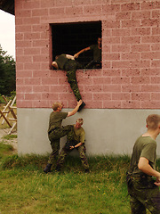 Image showing Soldier, climbing and team with training outdoor for fitness, exercise or challenge in nature with gear. Military, people and obstacle for workout, mission or bootcamp with camouflage for survival