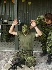 Image showing Military, exam to assemble a gun with a man soldier outdoor in camouflage uniform for an exercise. Army, blindfold and a person training at bootcamp to build a weapon or rifle in record time