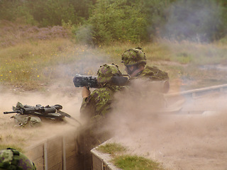 Image showing Battle, nature and soldiers at war in the army, training or bootcamp in the forest. Target, military and men or hero people in the woods for conflict, shooting or gun smoke on a field ffrom a squad