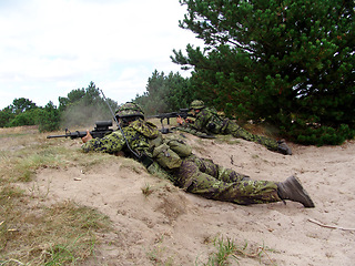 Image showing Military, soldier and target with weapon and aim for fitness, battle or challenge outdoor with gear or hiding. Army, people and attack for workout, mission or bootcamp with camouflage for survival