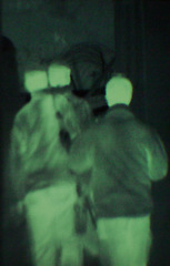 Image showing Military, people and green night vision, walking or dark silhouette of spy, agent or terrorist with soldier. Police, surveillance or men training in infrared scope for army or security mission
