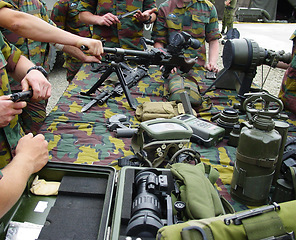 Image showing Military, gear and hands with gun, weapon or training with tools of war, artillery and ammunition. Army, soldier and men of group together in bootcamp, mission or outdoor with technology for battle